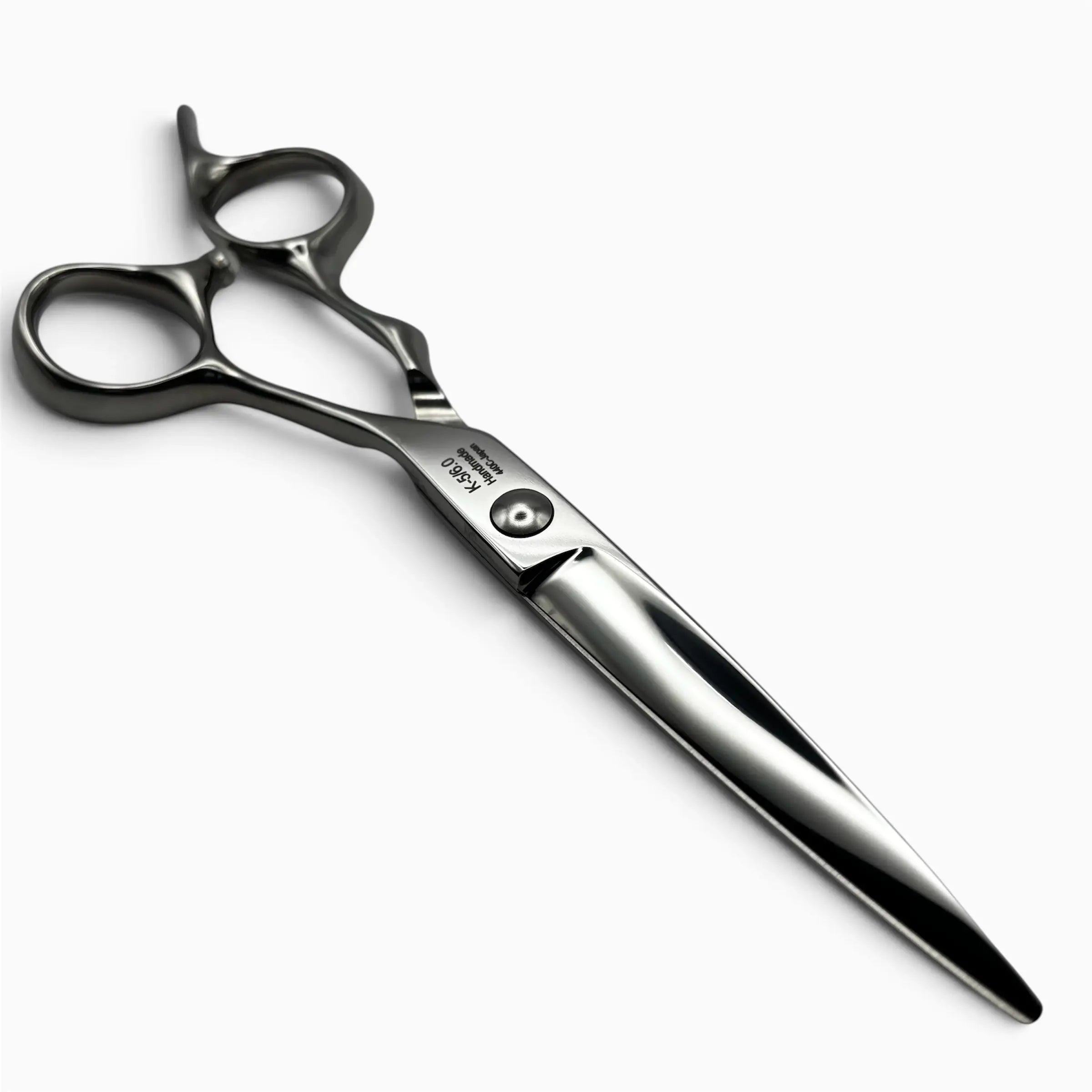 A pair silver K-5 professional hair shears with an ergonomic offset handle shown on a light grey background.