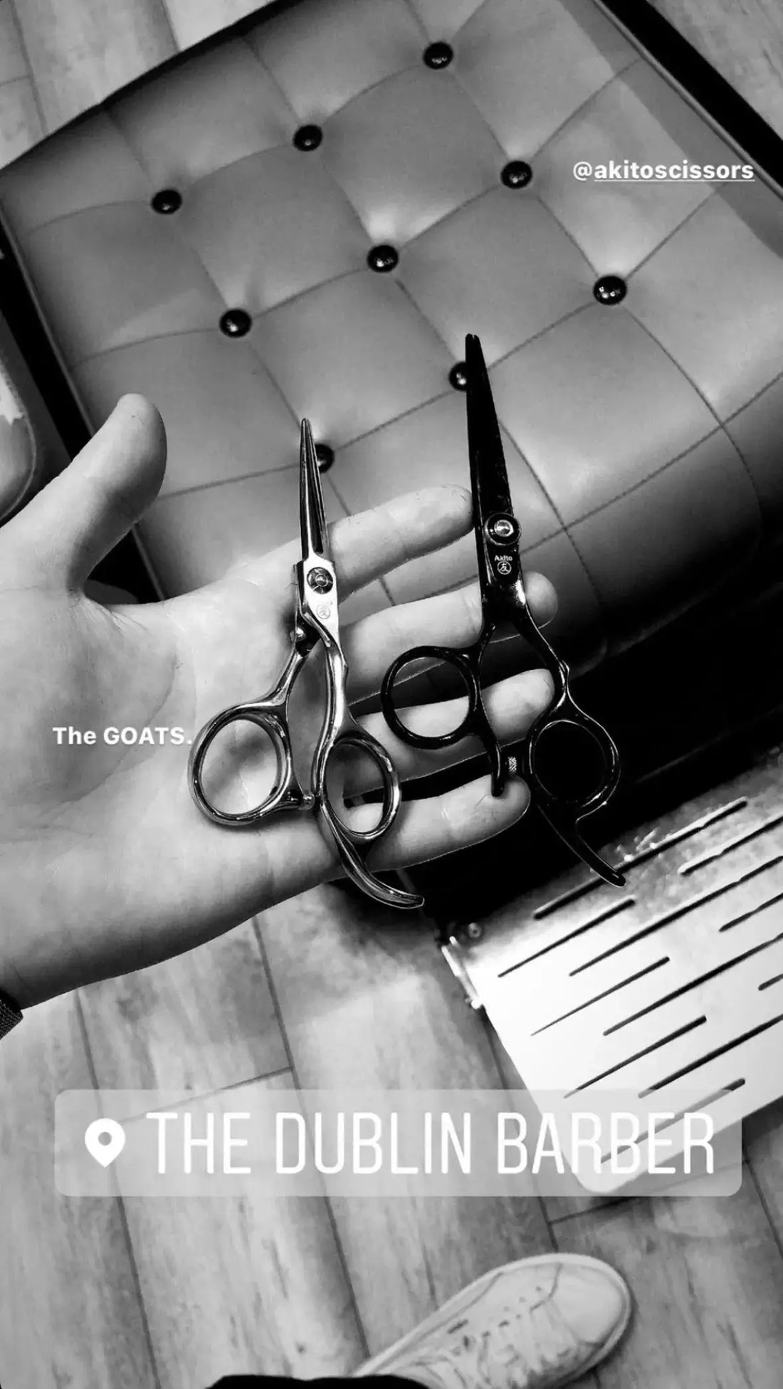Two pairs of akito scissors held by a hand with a blurred background, featuring the text 'The Dublin Barber' and '#aktossissors'.