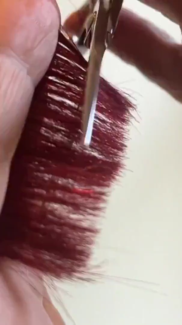 Barber cutting red hair with akito z-1 